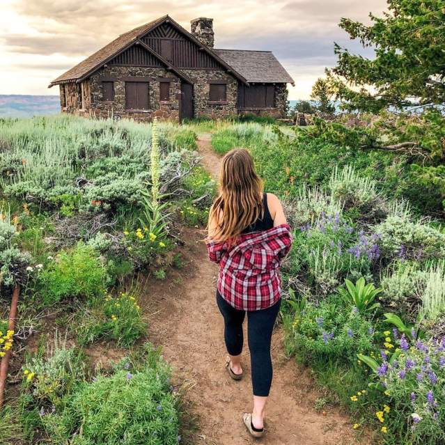 Woman Walking by Land's End Observatory on Grand Mesa